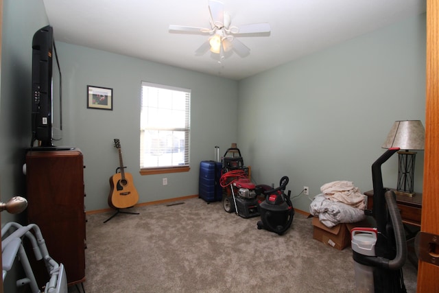 miscellaneous room with ceiling fan and light colored carpet