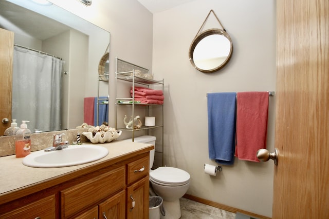 bathroom with toilet and vanity