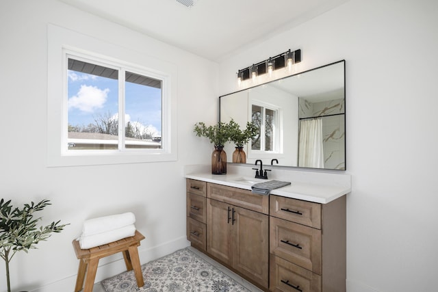 bathroom featuring a shower with curtain and vanity