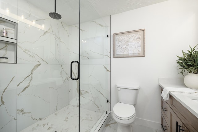 bathroom with toilet, an enclosed shower, and vanity