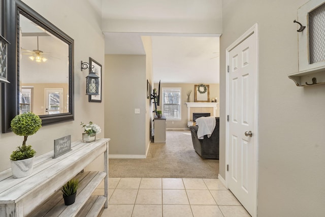 hallway featuring light colored carpet