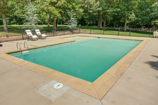 10350 Indian Ridge Ln, Carthage, MO 64836 - view of swimming pool featuring view of wooded area and a patio area