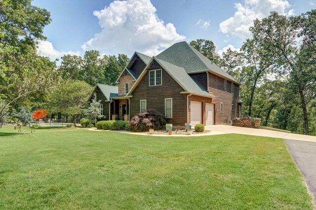 10350 Indian Ridge Ln, Carthage, MO 64836 - view of front of home featuring concrete driveway, a front yard, and roof with shingles