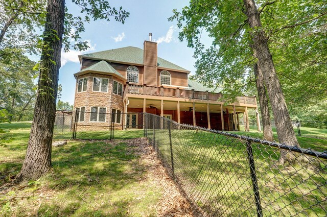 10350 Indian Ridge Ln, Carthage, MO 64836 - rear view of property with a chimney, a deck, a ceiling fan, and stone siding