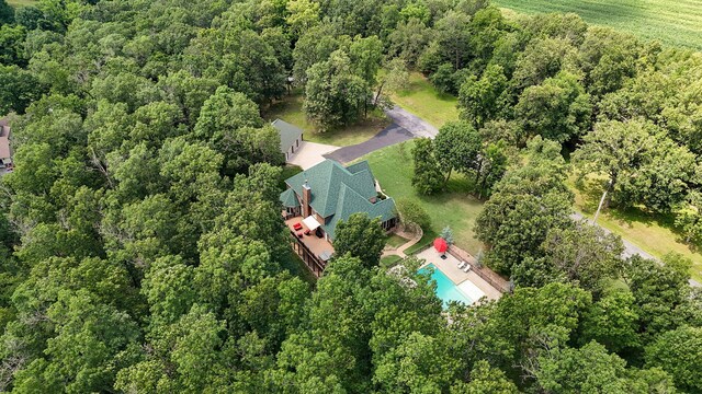 10350 Indian Ridge Ln, Carthage, MO 64836 - drone / aerial view of a pool area and a heavily wooded area