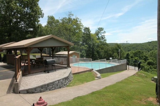 view of swimming pool with a patio area and a gazebo