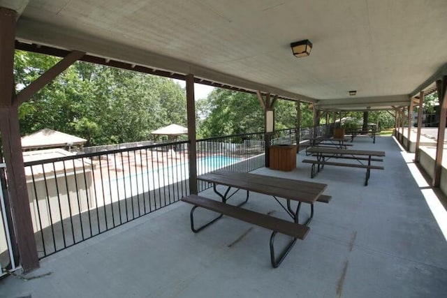 view of patio featuring a fenced in pool