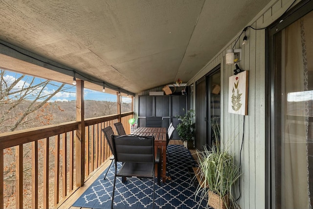 sunroom / solarium with lofted ceiling