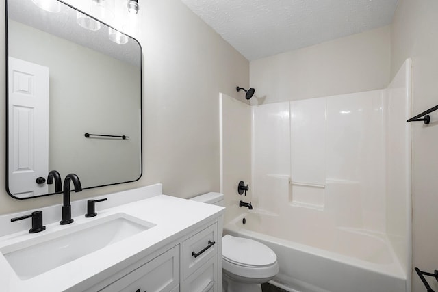 full bathroom with toilet, a textured ceiling, vanity, and bathing tub / shower combination