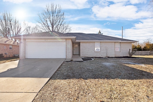 ranch-style home featuring a garage