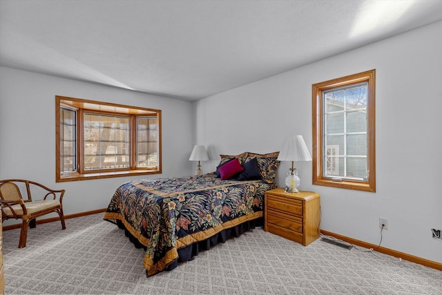 bedroom featuring light carpet