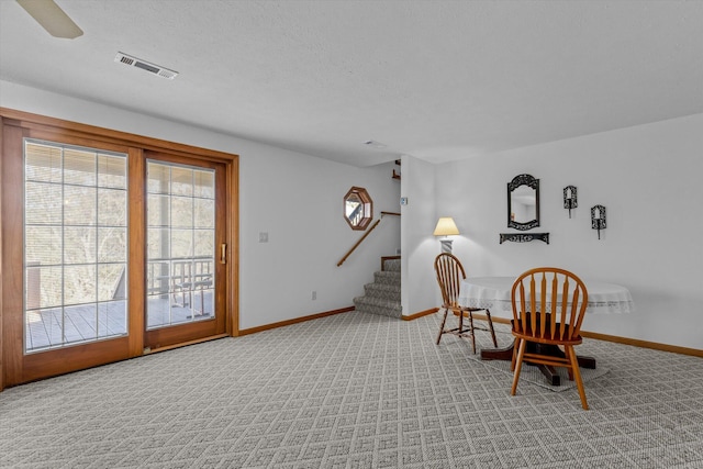 dining room featuring light carpet