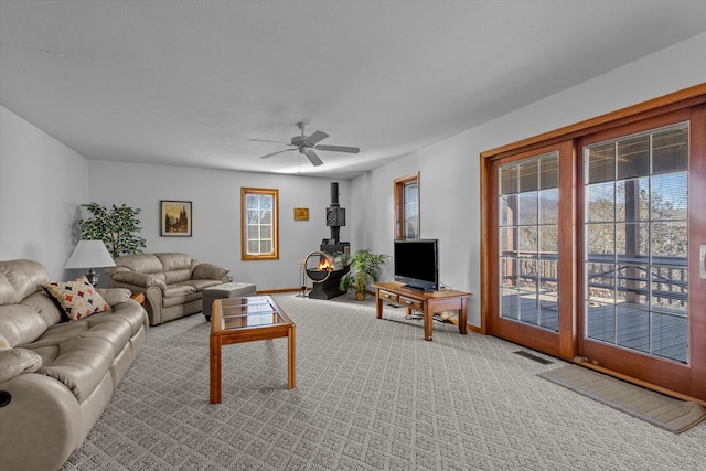 living room with carpet floors and ceiling fan