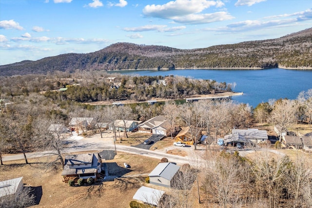 drone / aerial view with a water and mountain view