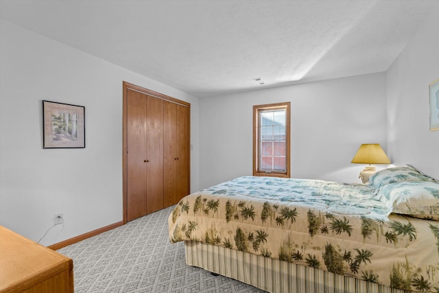 bedroom featuring light colored carpet and a closet