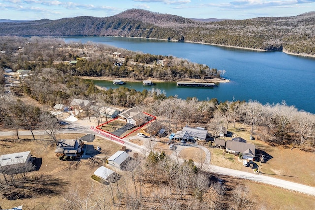 aerial view featuring a water and mountain view