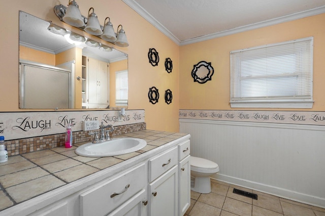 bathroom with toilet, crown molding, an enclosed shower, tile patterned flooring, and vanity