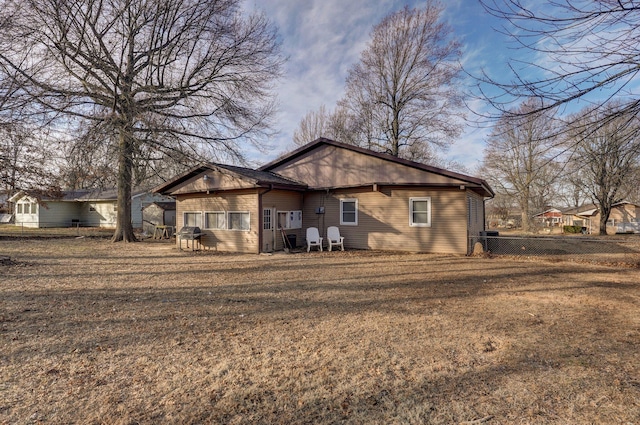 back of house with a yard