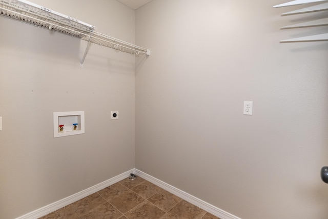 laundry room with tile patterned flooring, hookup for a washing machine, and hookup for an electric dryer