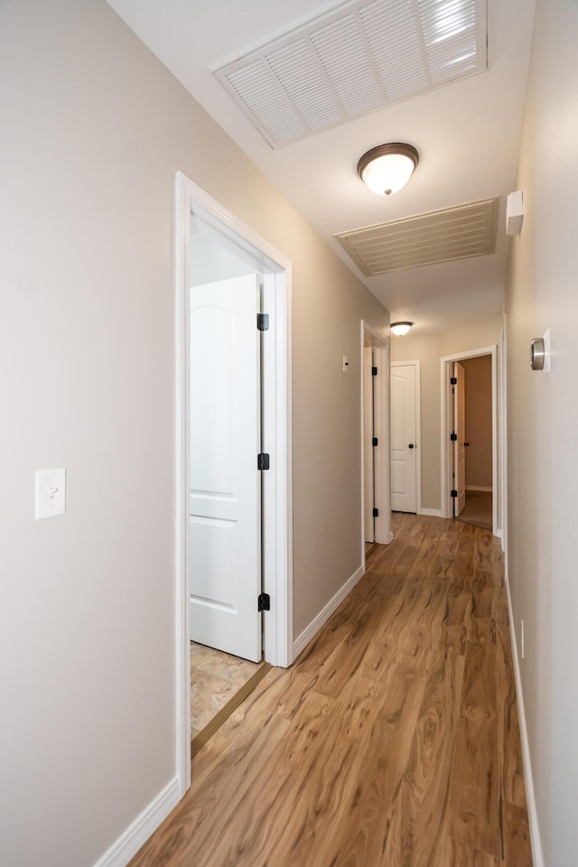 hallway featuring wood-type flooring