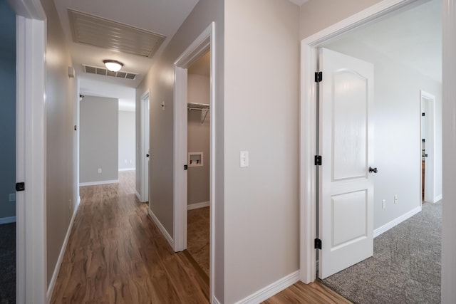 hall featuring dark wood-type flooring