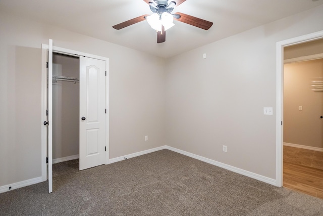 unfurnished bedroom with a closet, ceiling fan, and carpet flooring