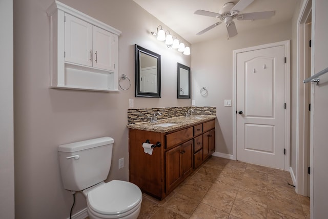 bathroom with vanity, backsplash, ceiling fan, and toilet