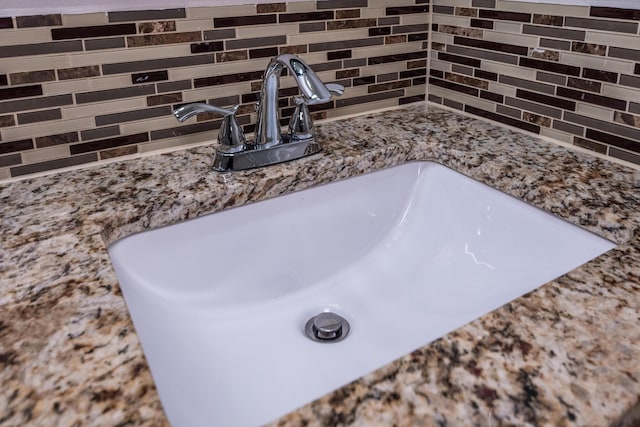 interior details with tasteful backsplash and vanity