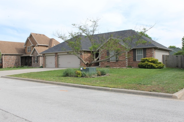 816 E Roubidoux St, Nixa, MO 65714 - view of front of home with a garage, concrete driveway, brick siding, and roof with shingles