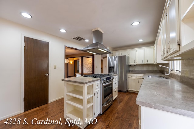 kitchen with appliances with stainless steel finishes, island exhaust hood, sink, a kitchen island, and backsplash