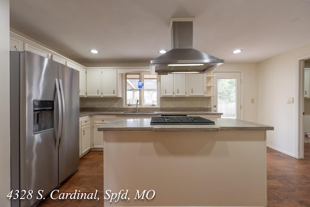 kitchen featuring white cabinets, appliances with stainless steel finishes, a kitchen island, island exhaust hood, and sink