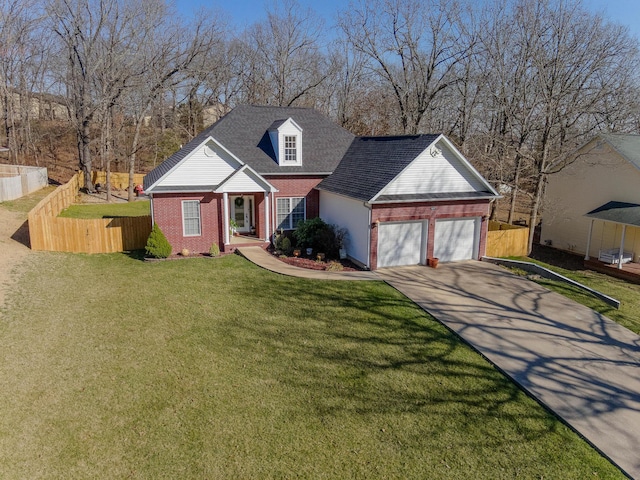 view of front of home with brick siding, driveway, and fence