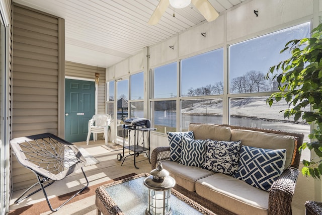 sunroom / solarium with ceiling fan