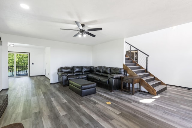 living room featuring ceiling fan and hardwood / wood-style floors