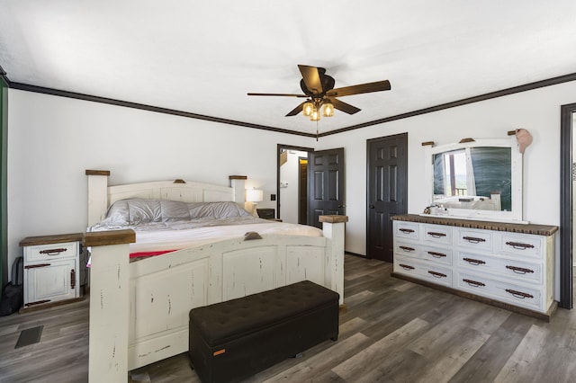 bedroom with ceiling fan, dark hardwood / wood-style flooring, and crown molding