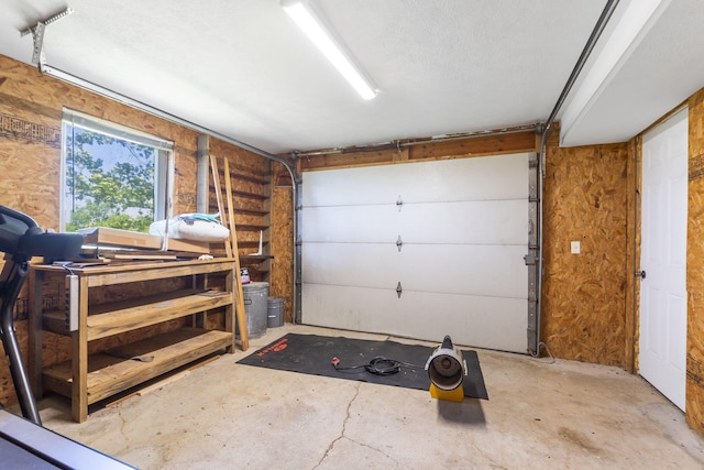 garage featuring wooden walls