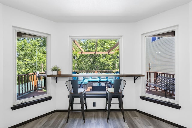 dining space featuring wood-type flooring