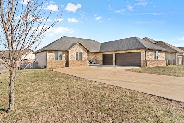 view of front facade with a front yard and a garage