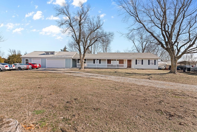 single story home with a porch, a garage, and a front lawn