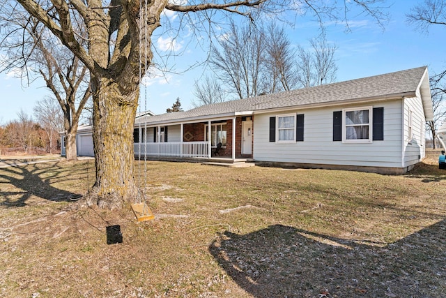 ranch-style house featuring a porch and a front lawn