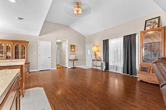 interior space with light hardwood / wood-style flooring and lofted ceiling