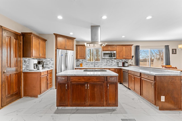 kitchen with tasteful backsplash, island range hood, a center island, and appliances with stainless steel finishes