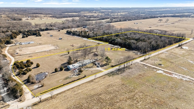 birds eye view of property featuring a rural view