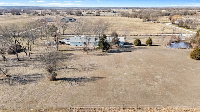 birds eye view of property featuring a rural view