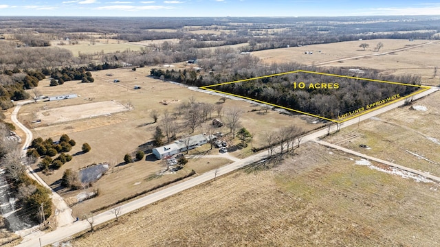 birds eye view of property with a rural view