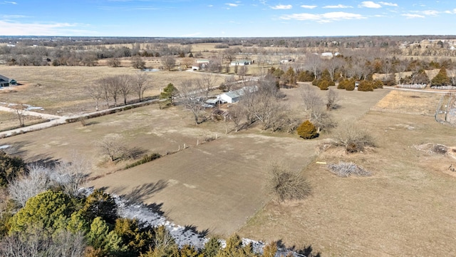 birds eye view of property with a rural view