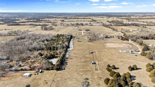 birds eye view of property featuring a rural view