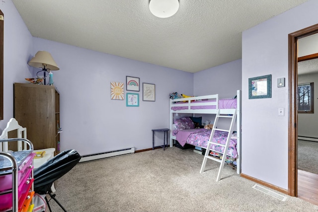 bedroom with carpet floors, a baseboard radiator, and a textured ceiling