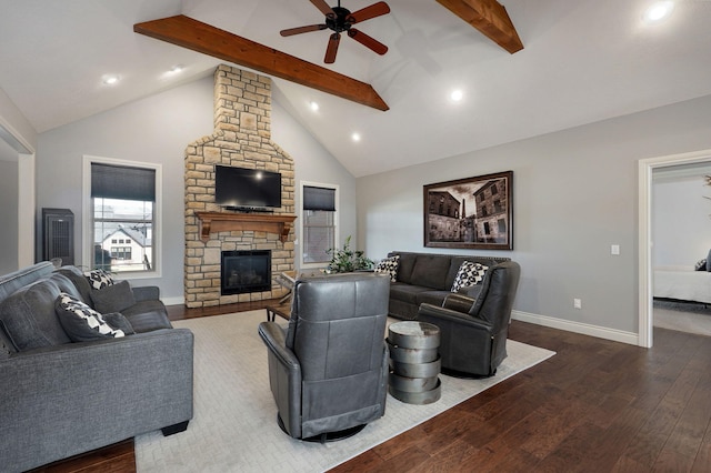 living room with a fireplace, vaulted ceiling with beams, dark hardwood / wood-style floors, and ceiling fan