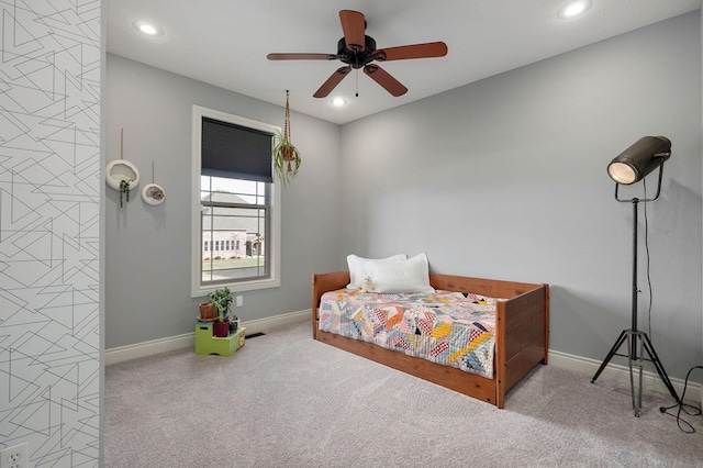 bedroom featuring ceiling fan and light colored carpet